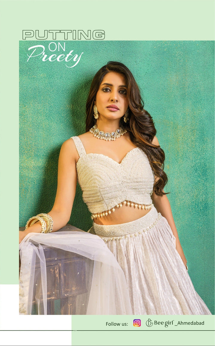 Off-White Lehenga with Floral Embroidery & Pearl Accent Blouse